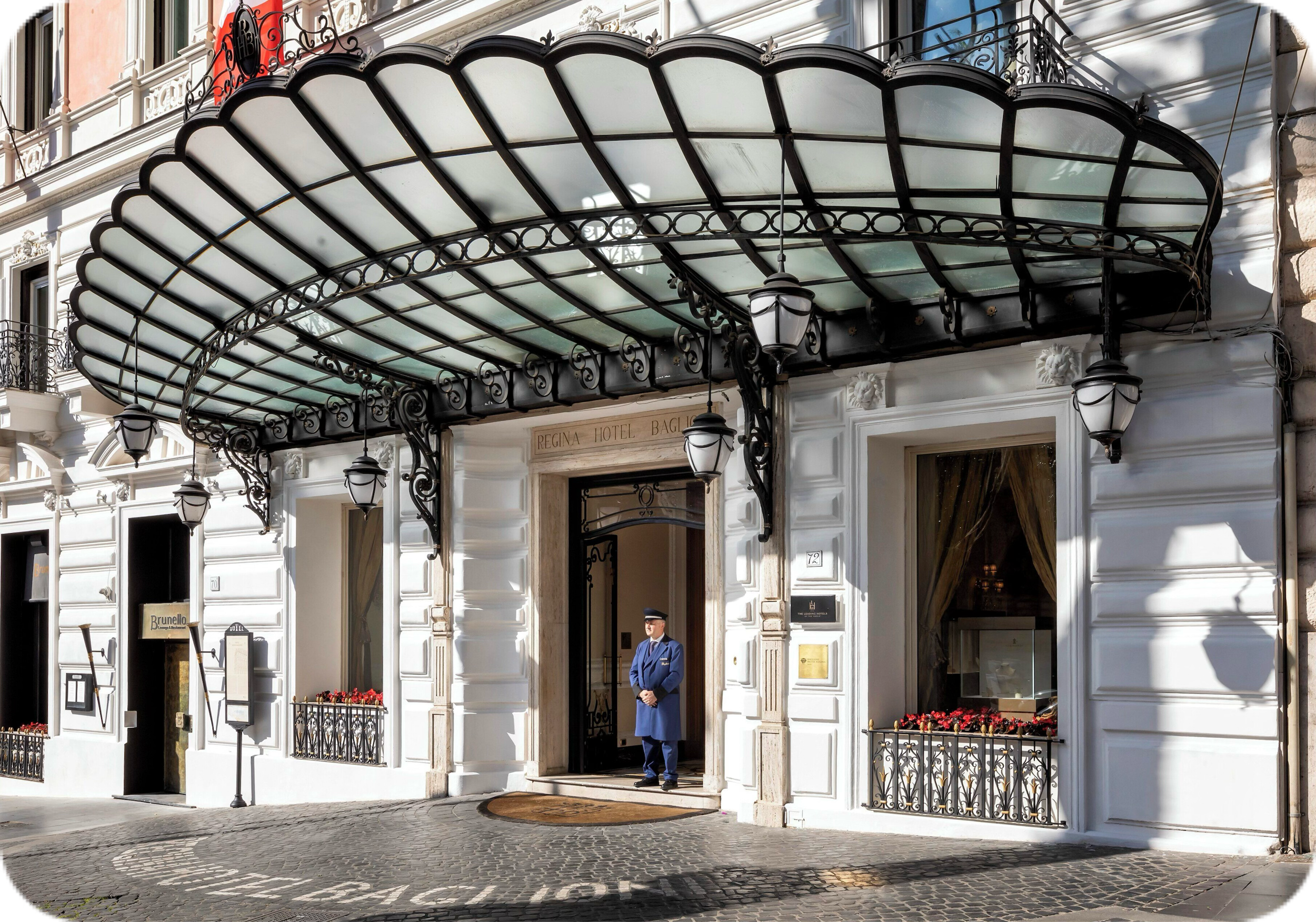 A doorman in front of the Baglioni Hotel Regina in Rome