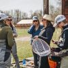 Lindsay Kocka with a Wade Well retreat group gather with their fishing kit