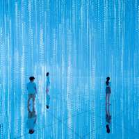 Visitors stand in a bright blue room, with vertical strips of sparkling lights, at the teamLab's Infinite Crystal World, Tokyo
