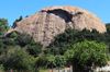 The large boulder named Eagle Rock is seen above power lines in California.