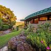 The curved exterior and garden of the Cornwell House, by Frank Lloyd Wright