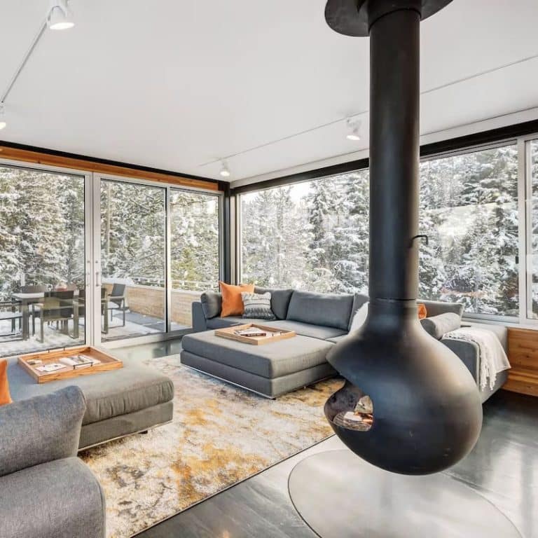 The floating modern fireplace in the living room at a Vrbo rental chalet in Winter Park, Colorado