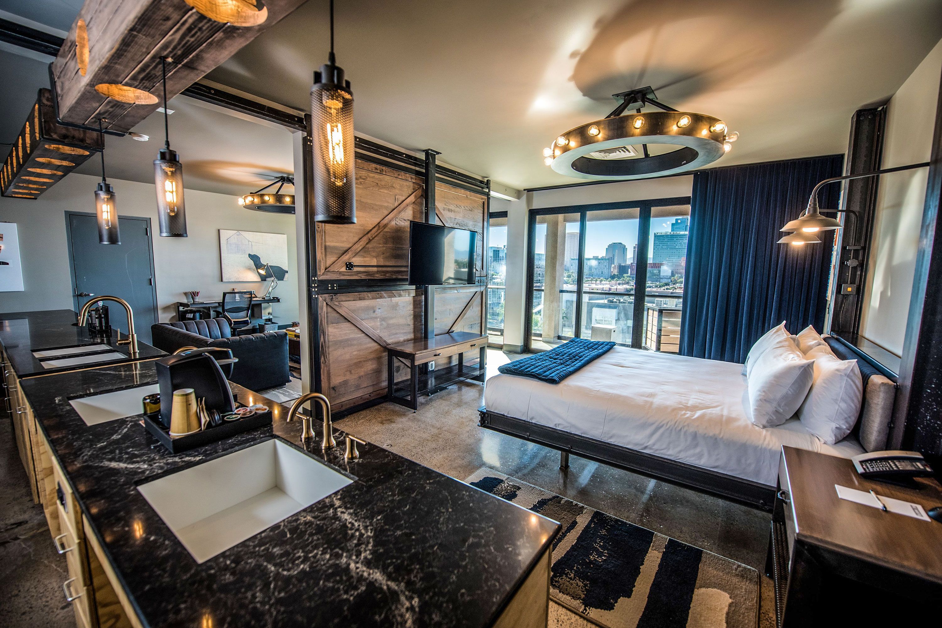 Interior view of an industrial and artsy room with dark metal and wooden features.