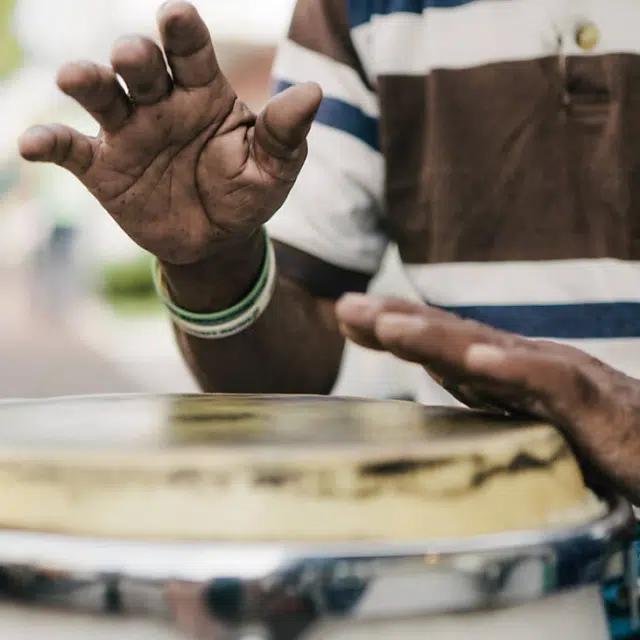 A close up of a person drumming