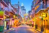 A colorful New Orleans street in evening lights.