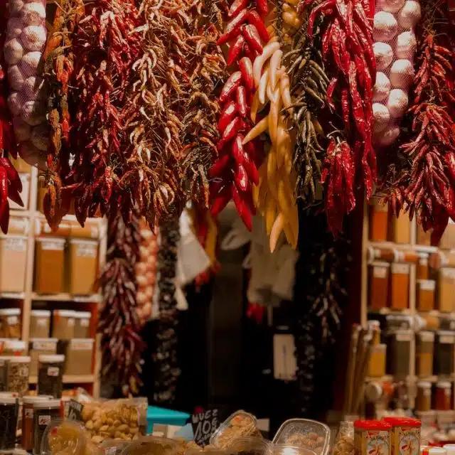 Spices and dried chilis at La Boqueria market in Barcelona, Spain