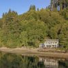 A view from the water of a lake front Vrbo in Washington State