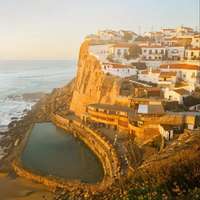 Hemmed by a wall just above the beach and below the town, the seawater pool at Azenhas do Mar