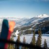 The Canadian Rockies, pictured snow-covered with evergreens in the foreground, offer world-class skiing