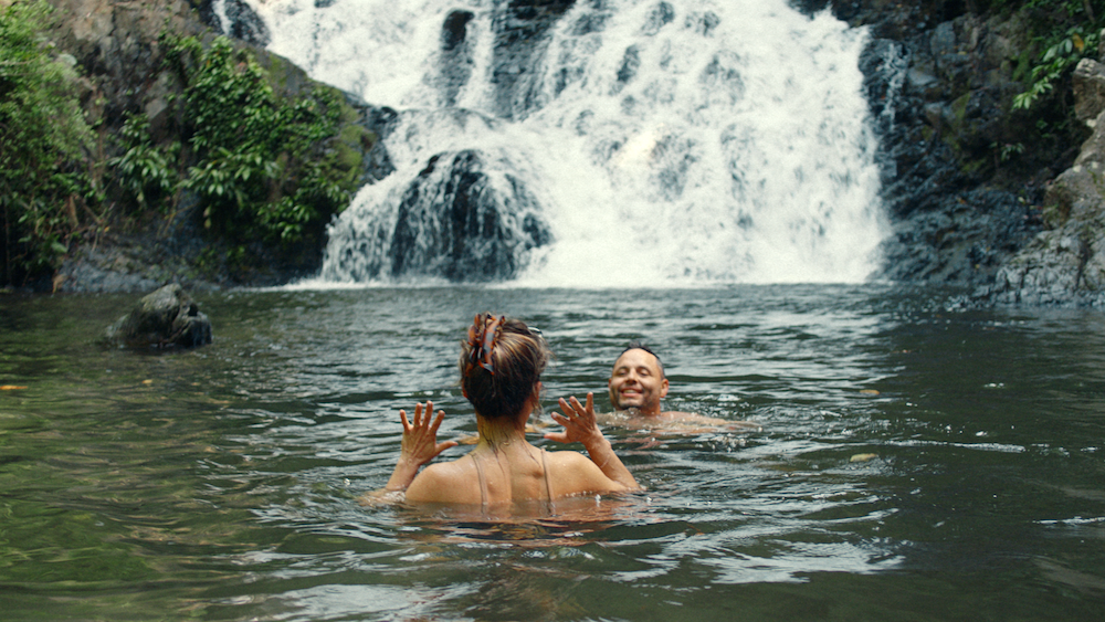 Chef José Olmedo Carles Rojas and his wife Chevy Tyler swim around the Quebrada Bonita waterfall in Panama