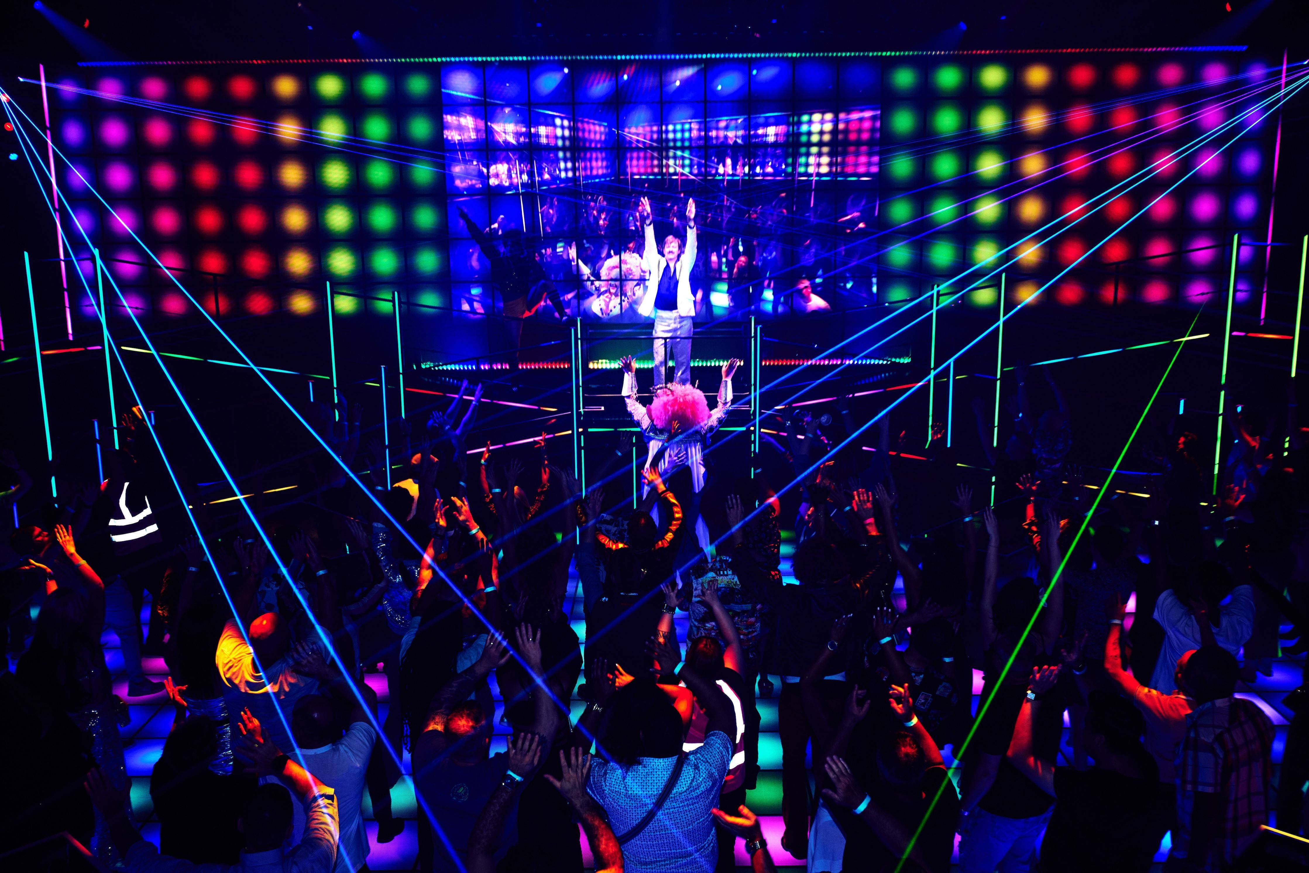 Rainbow lights and performers at the immersive DiscoShow by troupe Spiegelworld in Las Vegas, Nevada