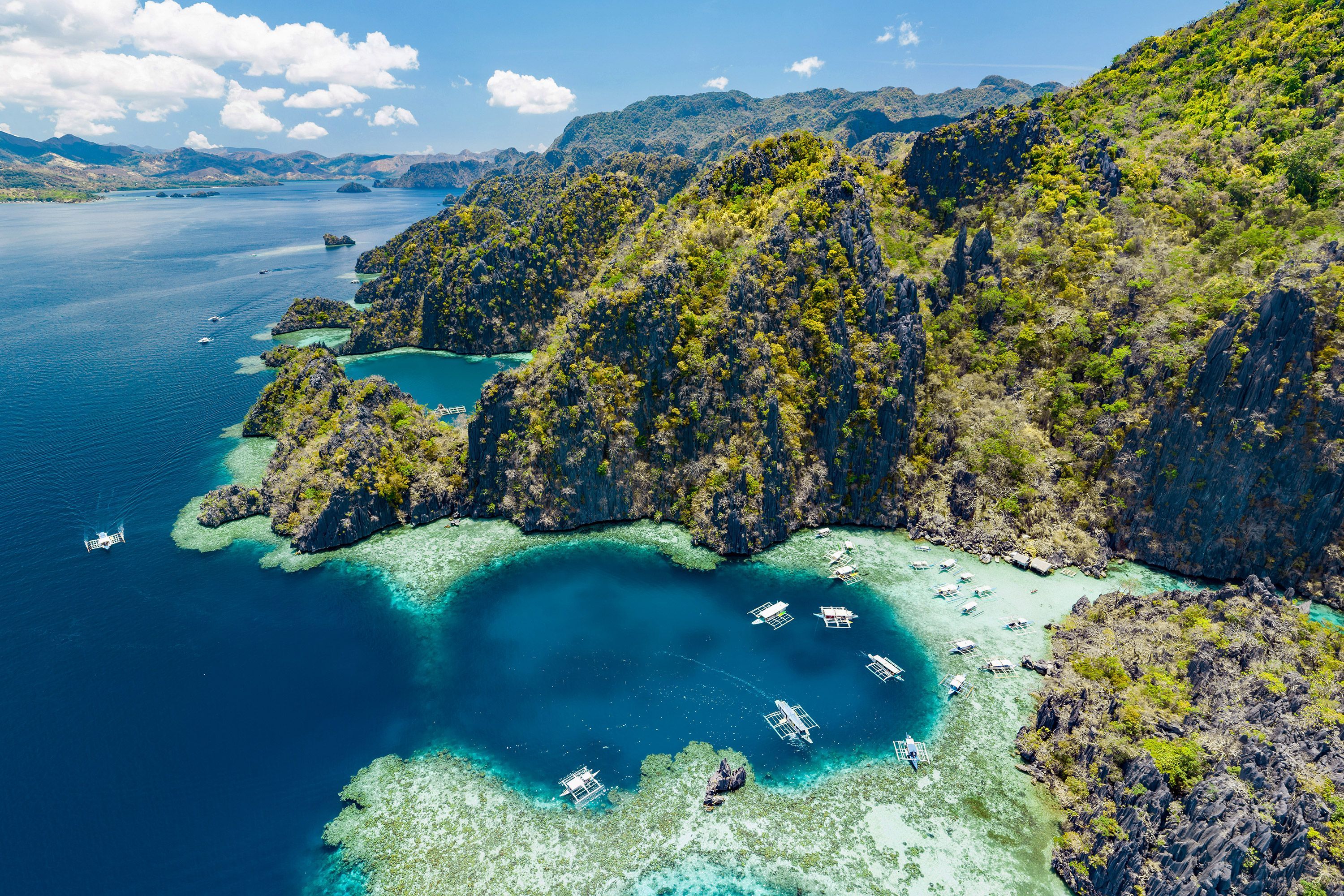 Aerial view of lagoons and limestone cliffs of Palawan, Philippines.