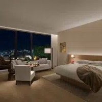 A sophisticated bedroom with floor-to-ceiling windows looking out onto the city at The Tokyo Edition, Toranomon in Tokyo, Japan
