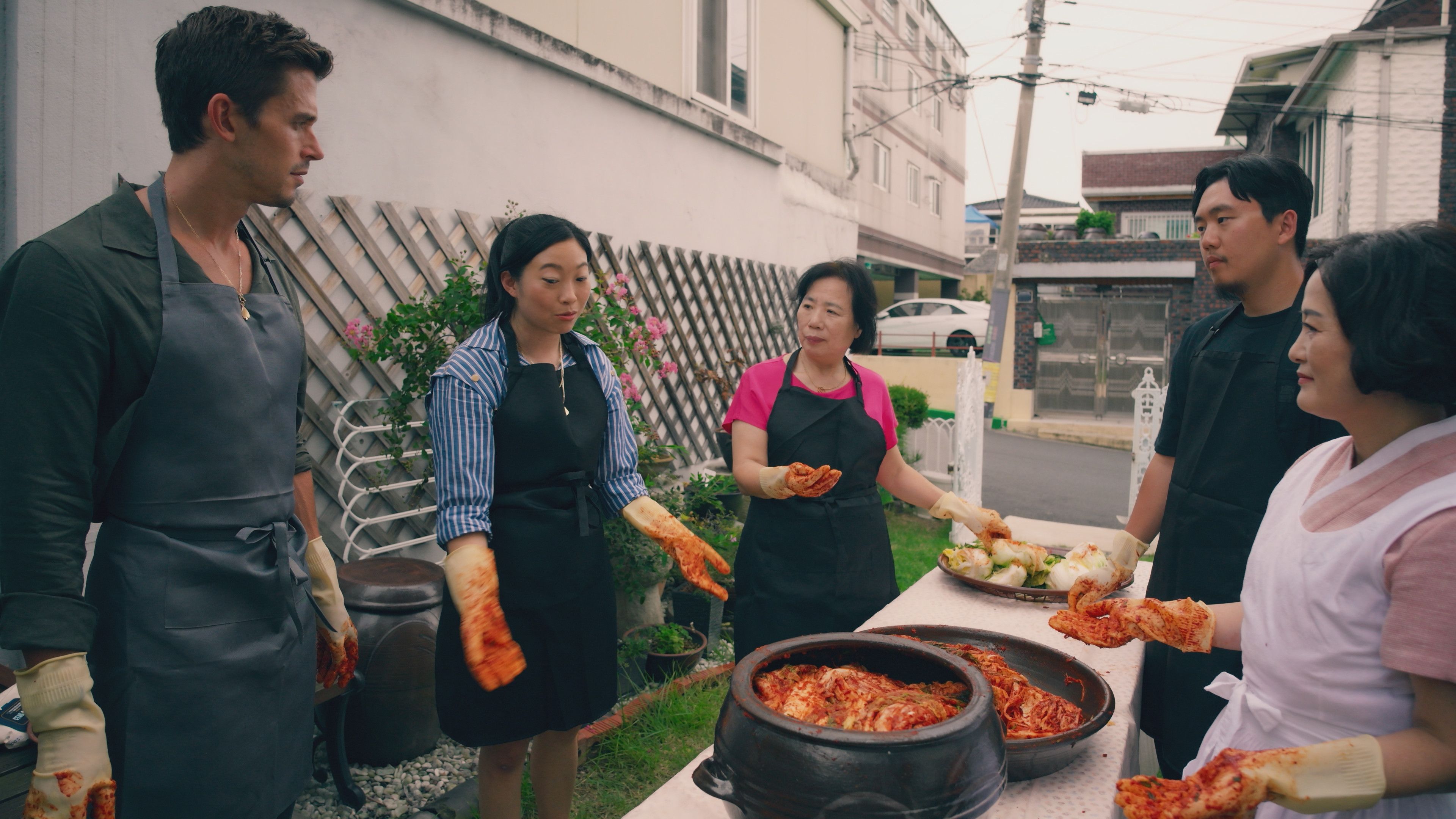 Antoni Porowski and Awkwafina get a lesson in kimchi. Photo: National Geographic/Seong Joon Cho