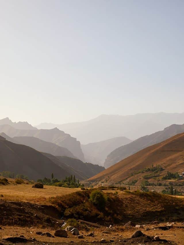 The Pamir Mountains, Tajikistan, form a dramatic skyline that seems to go on forever