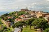 Aerial view of trees and buildings in Montalcino, Italy.
