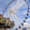 A Ferris wheel on a city pier.
