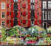 View of Amsterdam floating flower market (Bloemenmarkt) greenhouses moored in front of brick row houses at edge of Singel canal. 