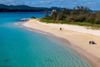 Turquoise waters lap the shore of Kouri Beach in Okinawa, Japan