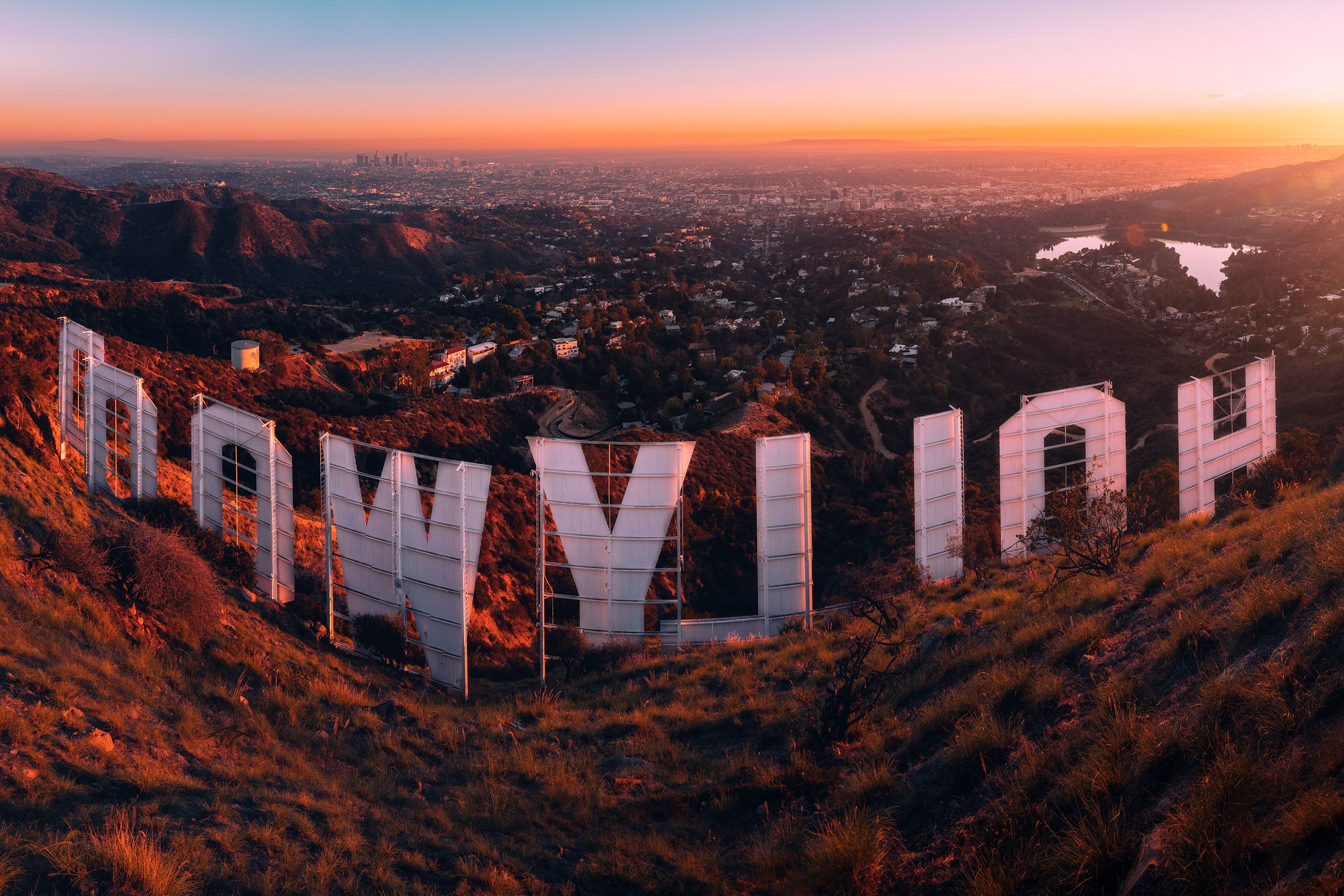 A sunset view of the hollywood sign from above.