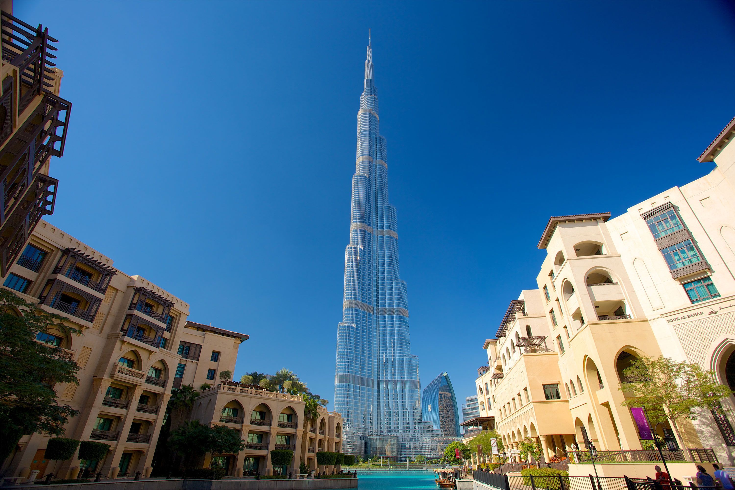 View of the Burj Khalifa skyscraper towering above the Dubai skyline on a clear day.