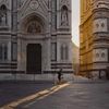 A person jogs past the Cathedral of Santa Maria del Fiore in Florence, Italy