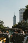 The Torre Latinoamerica, a skyscraper in Mexico City, as seen from an open top sightseeing bus