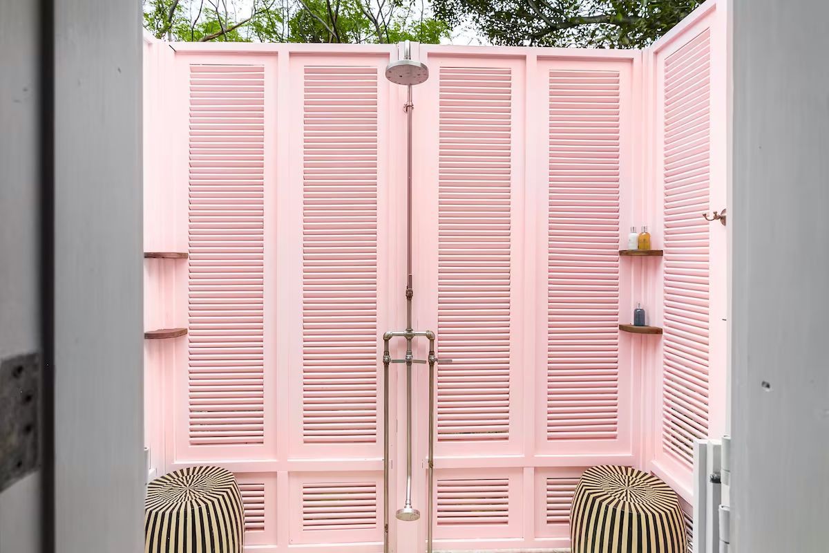 The pink-walled outdoor shower