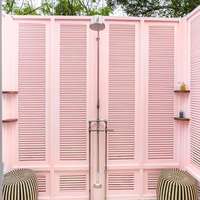 The pink-walled outdoor shower