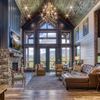 A rustic fireplace beneath exquisite vaulted ceilings in a Gatlinburg Vrbo