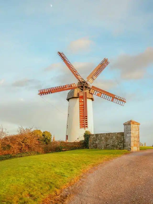 A white windmill with red sails in Skerries, Ireland