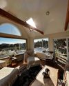 The living room of a Vrbo in Cape Cod, with an extensive view
