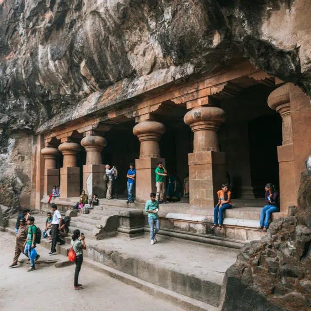 Visitors explore the 7th-century Hindu cave temples on Elephanta Island in India