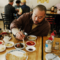 David Chang at Ham Hung in Koreatown, LA, eating noodle soup