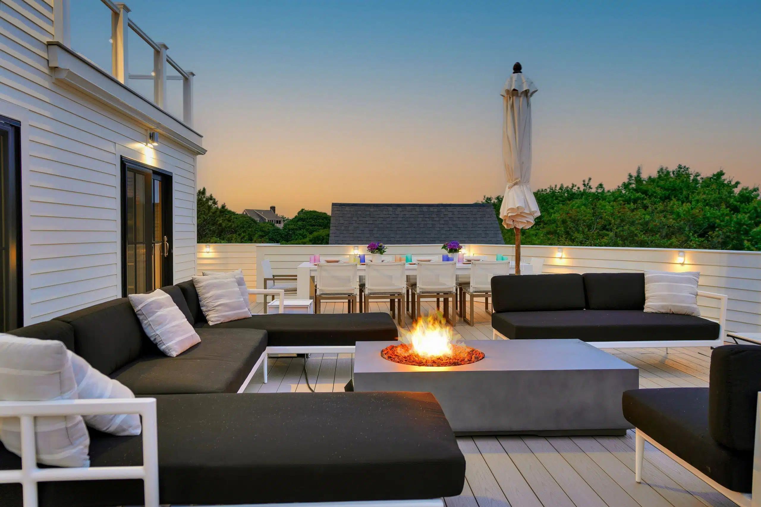 The firepit and comfy backyard of a Vrbo in Cape Cod