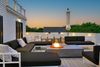 The firepit and comfy backyard of a Vrbo in Cape Cod