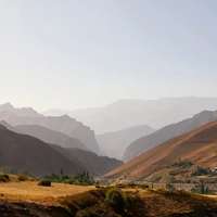 The Pamir Mountains fade into the distance outside of Qal’ai Khumb, Tajikistan