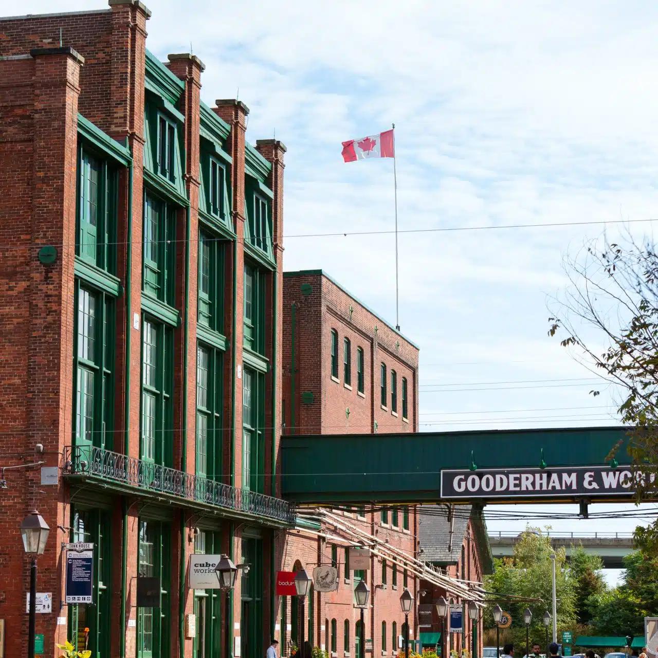A former factory building flying a Canadian flag in the Distillery Historic District, Toronto