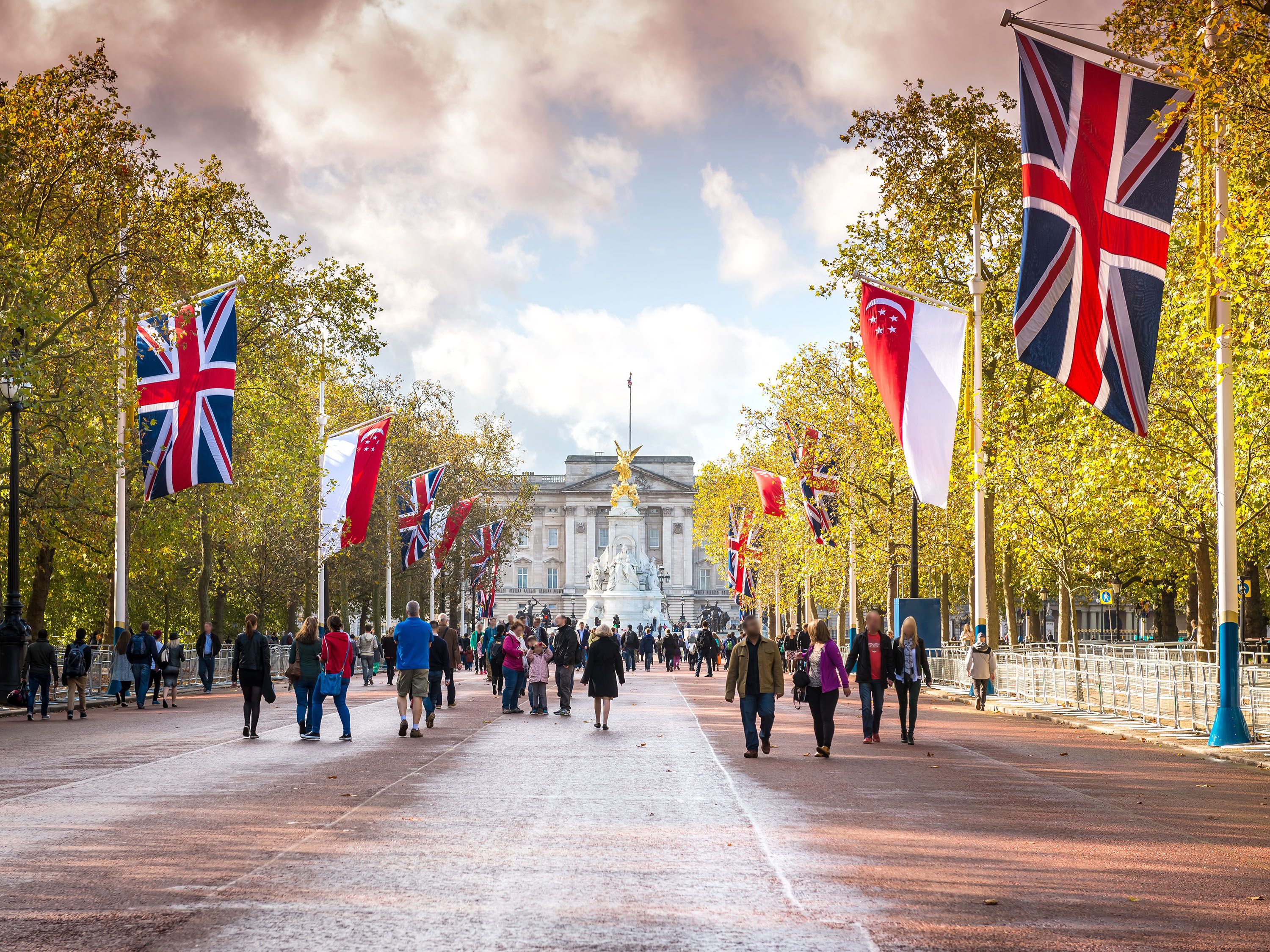 Road lined with British flags leading to Buckingham Palace.