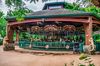 Jungle themed exterior merry-go-round with ceiling fans.