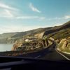 A road running between coastline and hillside in Tijuana, Mexico