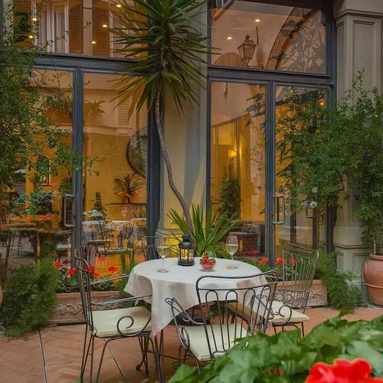 The romantic outdoor courtyard at Rivoli Boutique Hotel in Florence, Italy