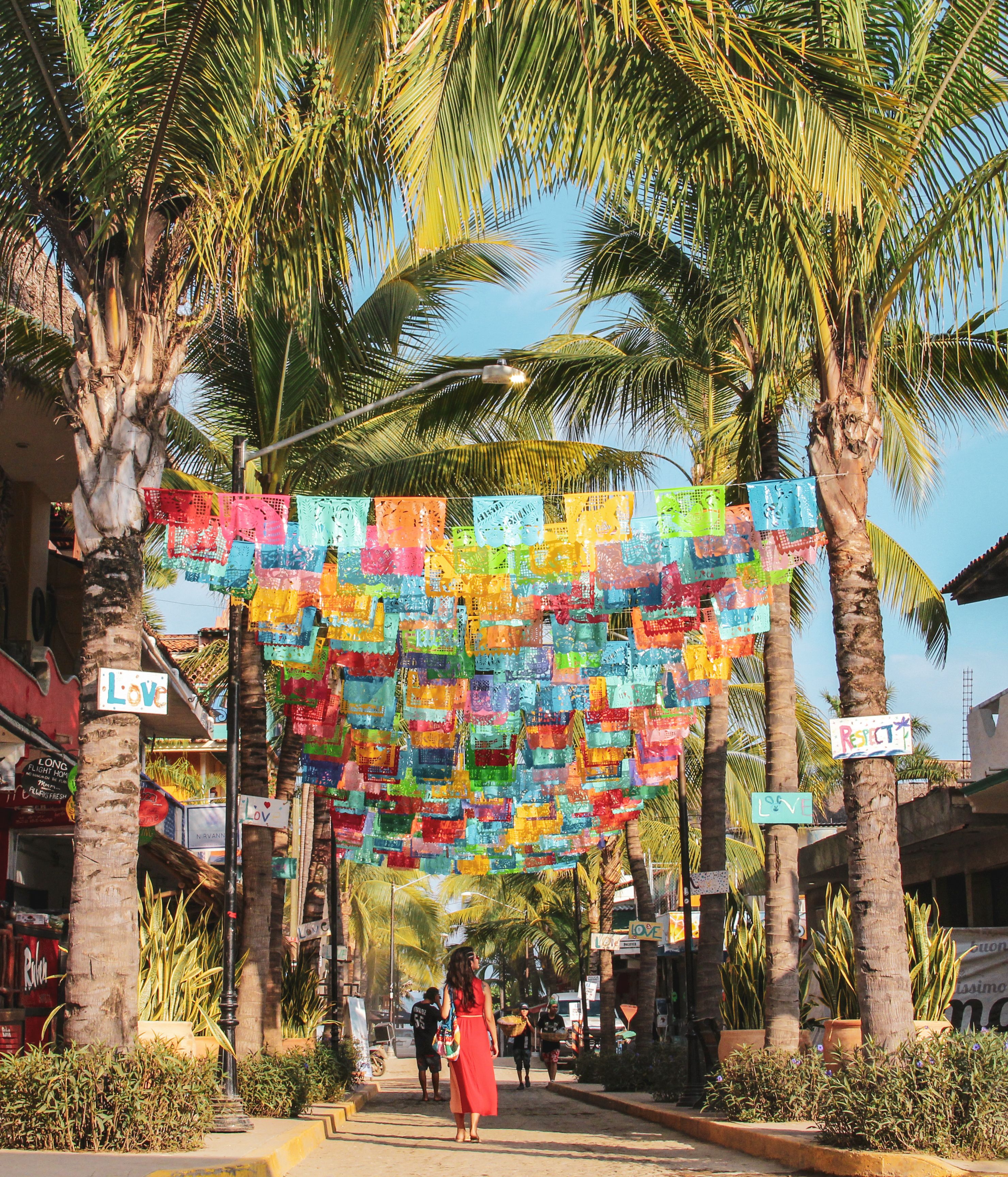 Colorful papel picado flutter over the streets of Sayulita