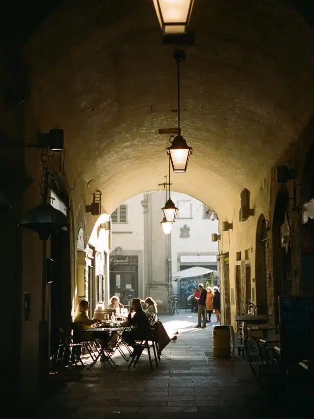 People dine alfresco at Arco di San Pierino in Florence, Italy