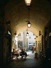 People dine alfresco at Arco di San Pierino in Florence, Italy