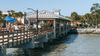 Explore St. Simons Island's picturesque pier and vibrant waterfront atmosphere on a sunny day in Brunswick, Georgia, showcasing local activities and natural beauty.