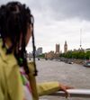 Traveler in London looking at Big Ben and the Thames River