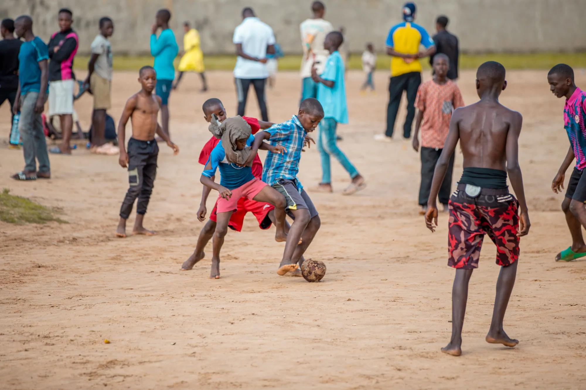 Young people marking out a new football pitch