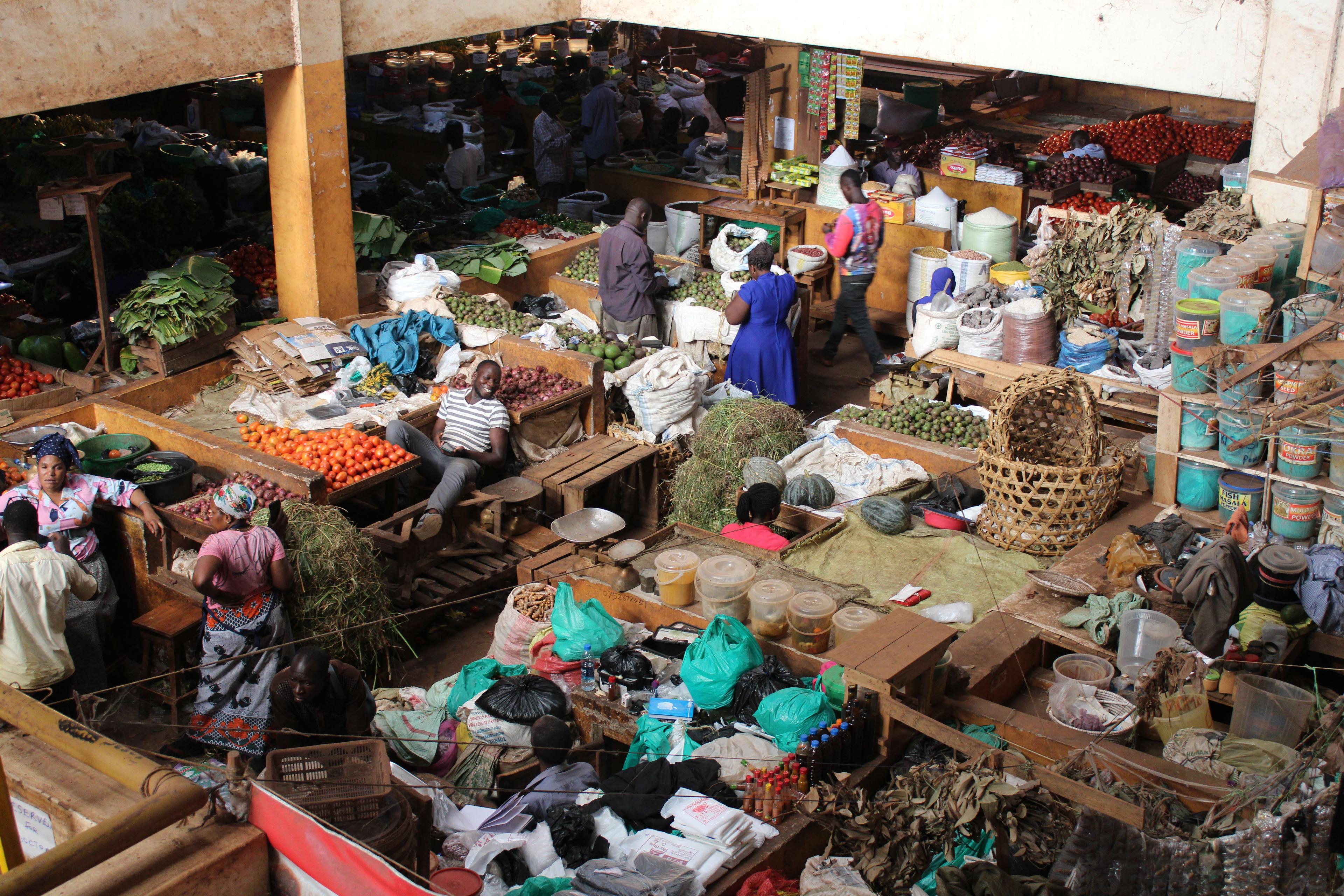 A market vendor checking a mobile money transaction safely