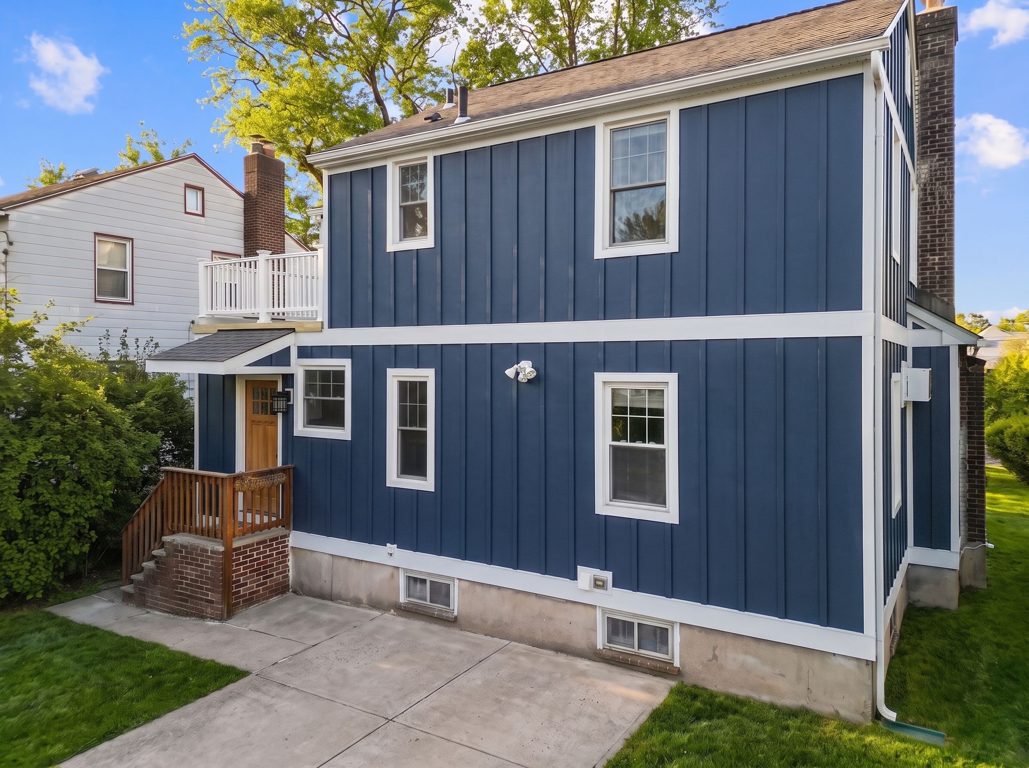 House with navy board and batten siding